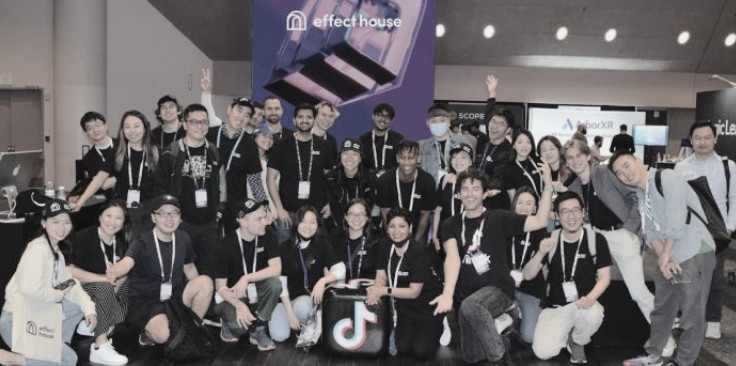 The Effect House team photographed together in front of an Effect House screen