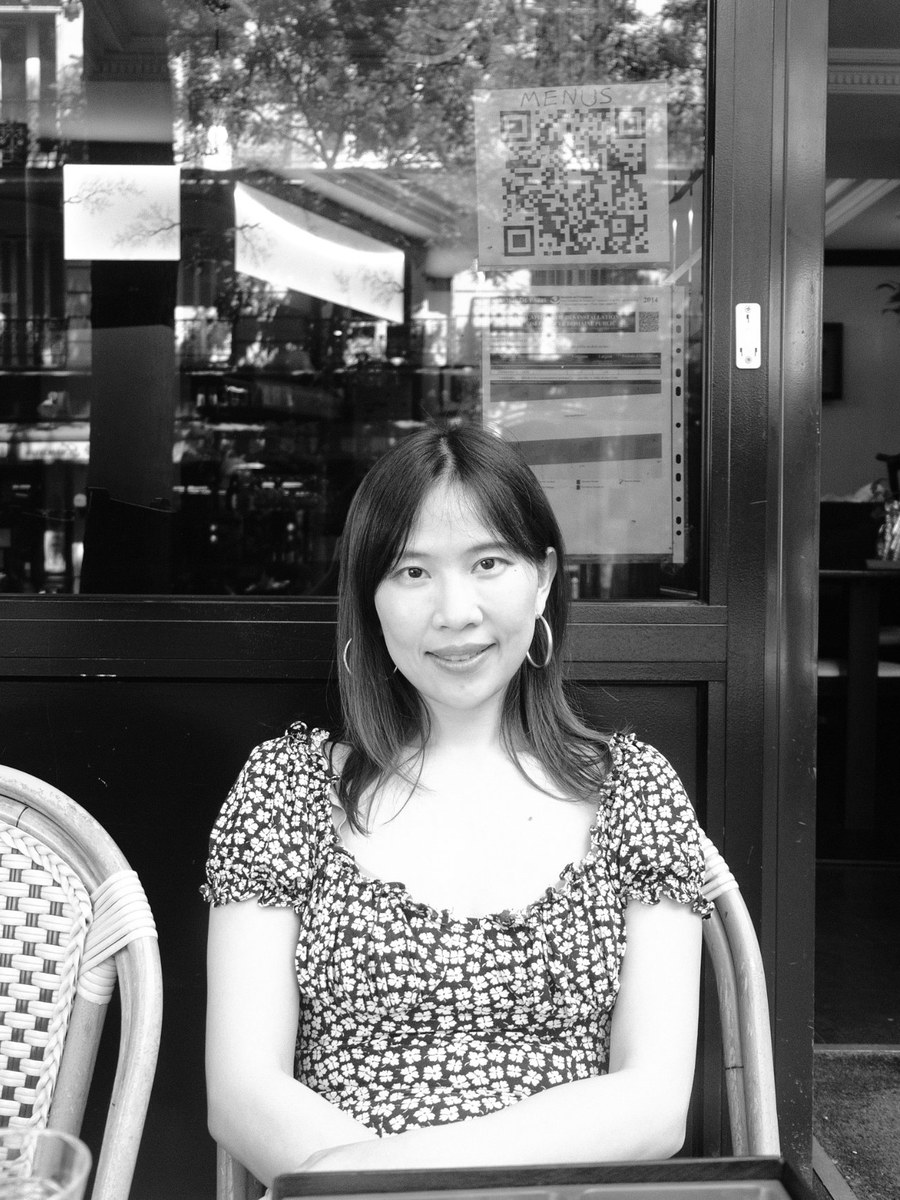 Marina Cui, seated outside a Paris cafe, in black and white
